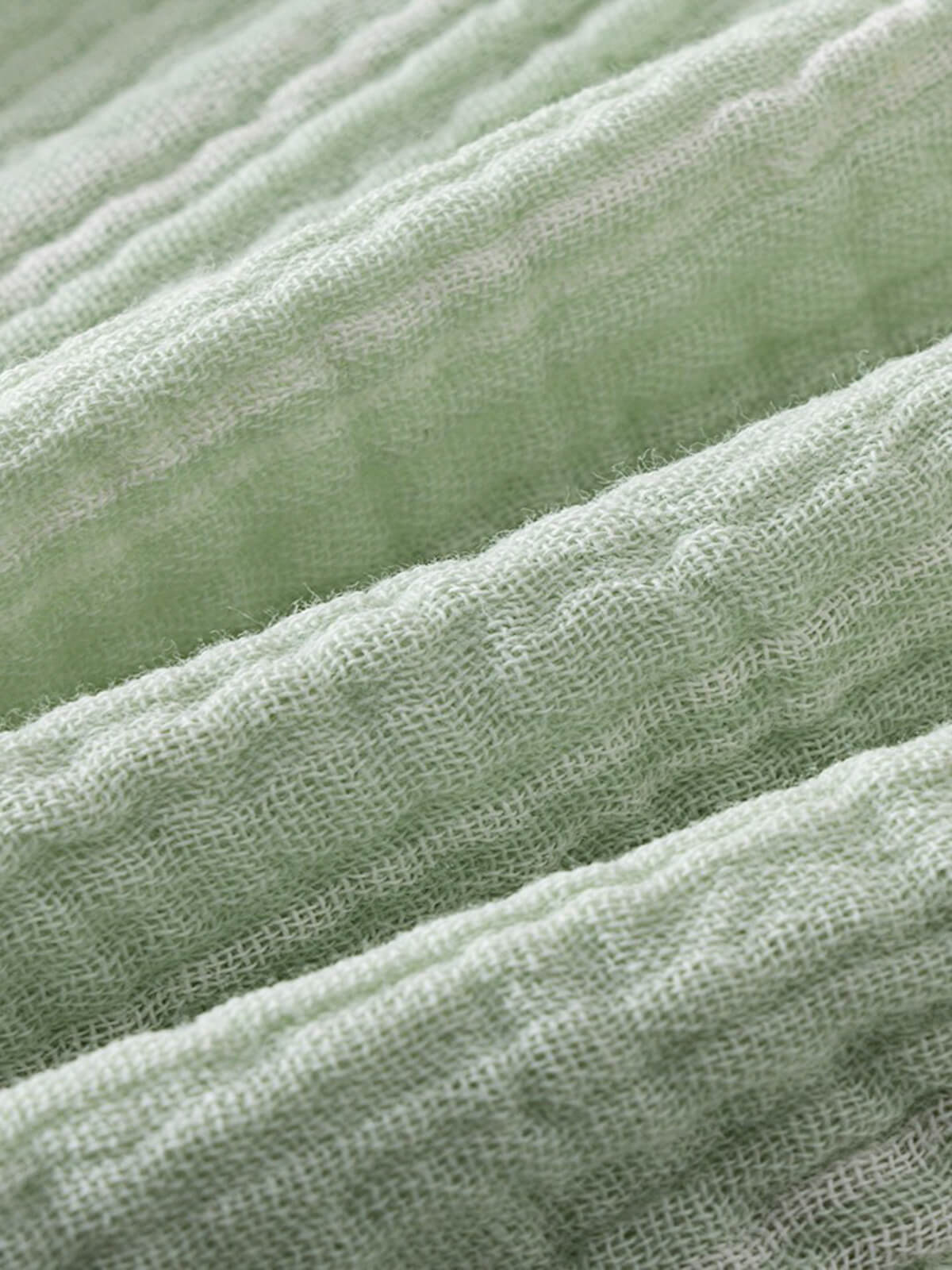 Close-up of light green and white striped fabric with soft texture Muslin Shorts - Light Green Stripe Baby boy