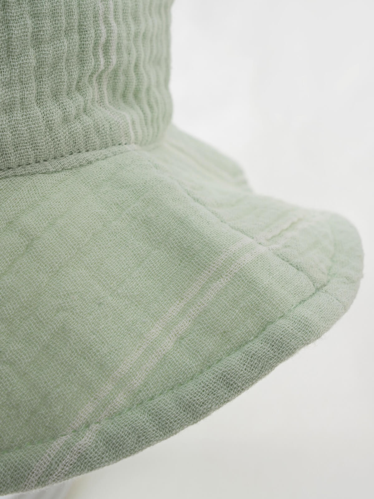Close-up of sage green linen sun hat brim and crown detail baby-muslin Sun Hat - Green Stripe Baby boy