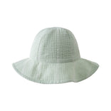 Pale green textured cotton sun hat with wide brim on white background Baby Muslin Sun Hat - Green Stripe Baby boy