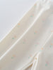 Close-up of cream fabric with small pastel floral print pattern Baby Printed Leggings- Spring Bloom Baby girl
