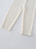 Close-up of cream-colored leggings with small floral print pattern Baby Printed Leggings - Spring Bloom Baby girl