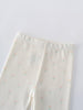 Close-up of cream-colored baby leggings with small pastel floral print Baby Printed Leggings- Spring Bloom Baby girl