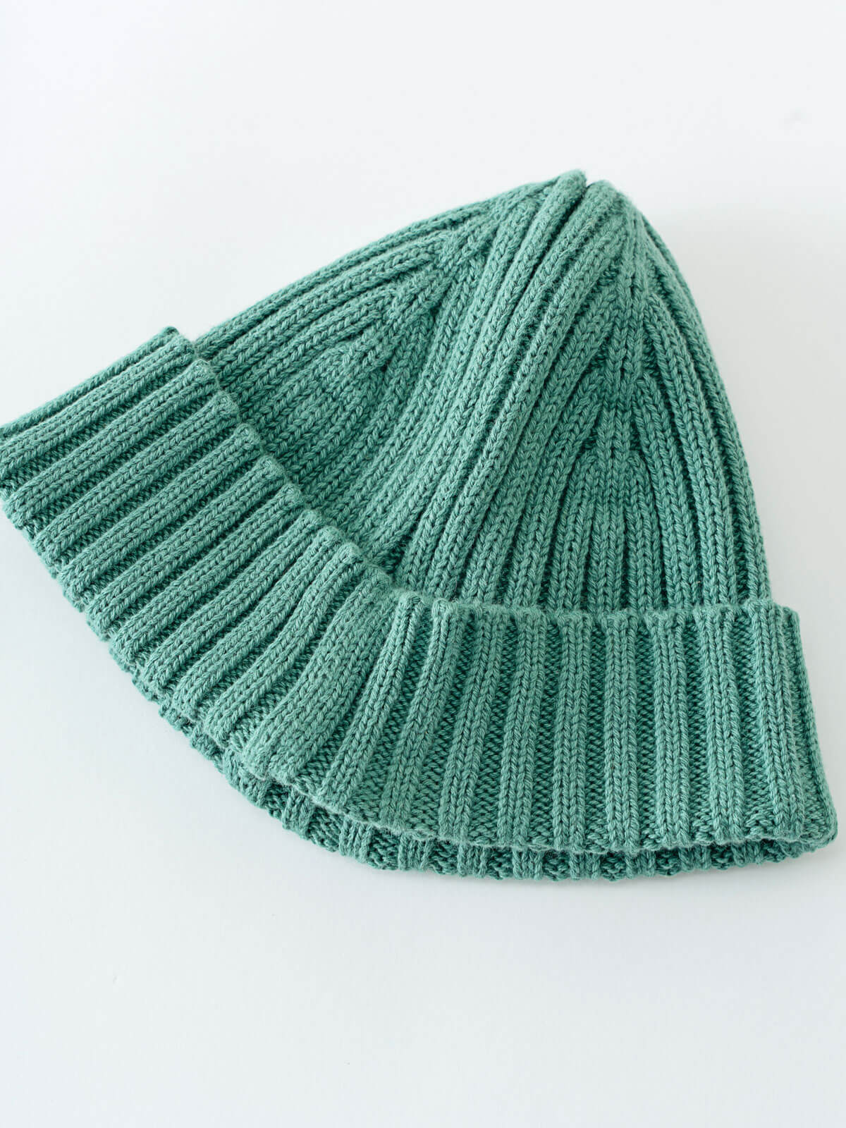 Green knitted beanie on a white background Baby Ribbed Beanie - Balsam Baby boy