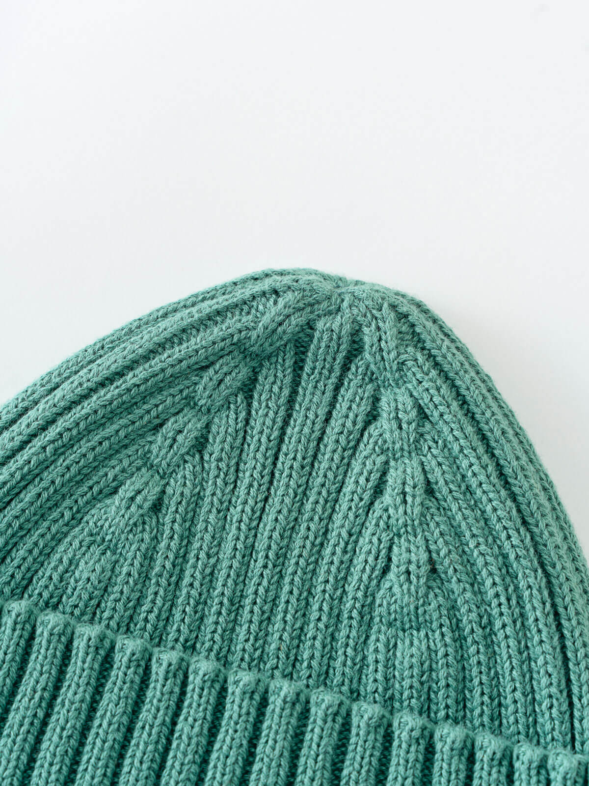 Close-up of a teal knitted beanie on a light gray background Baby Ribbed Beanie - Balsam Baby boy