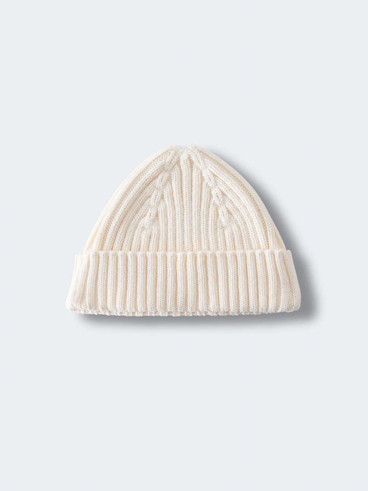 White knit beanie on a light gray background Baby Ribbed Beanie - Ecru Baby boy