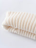 Folded cream-colored knitted fabric on a white background Baby Ribbed Beanie - Ecru Baby boy