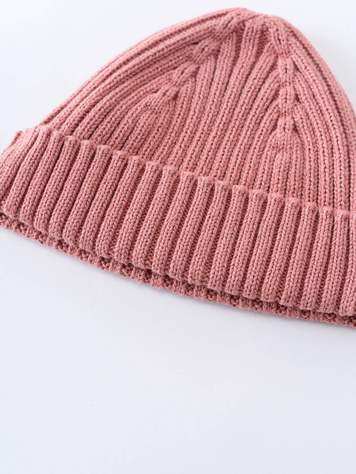 Pink knit beanie on a white background Baby Ribbed Beanie - Rosehip Baby girl