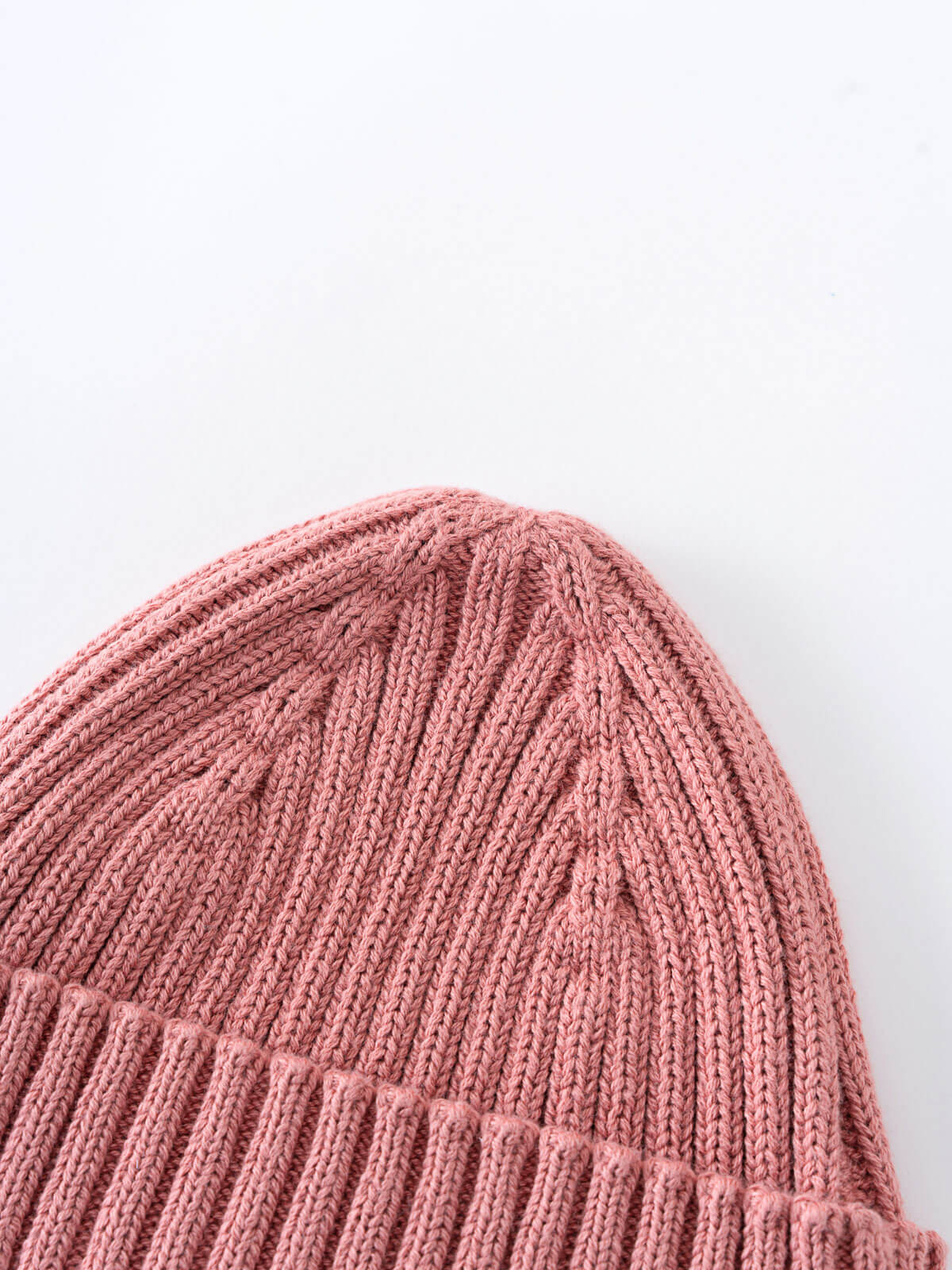 Close-up of a pink knitted beanie on a light gray background Baby Ribbed Beanie - Rosehip Baby girl