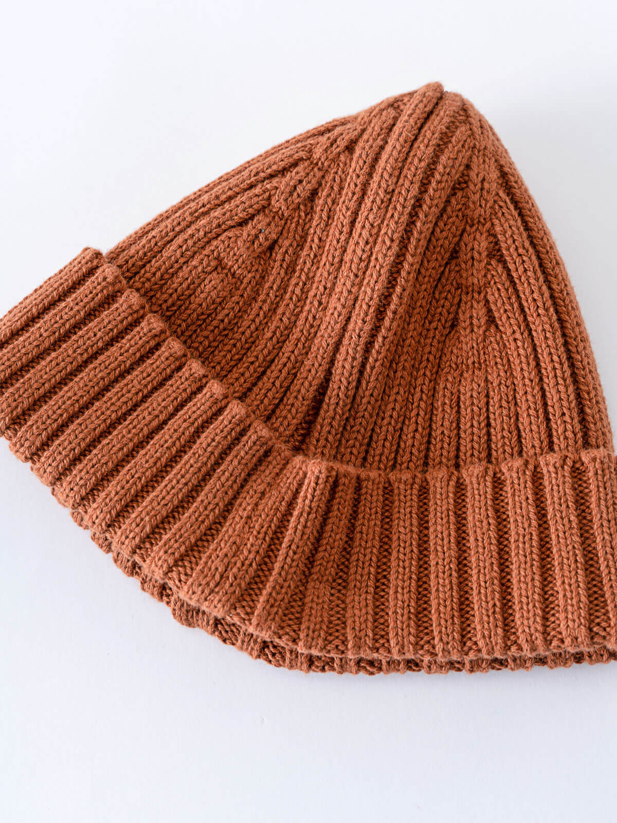 Brown knitted beanie on a white background Baby Ribbed Beanie - Russet Baby boy