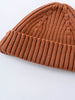 Brown knitted beanie on a light gray background Baby Ribbed Beanie - Russet Baby boy