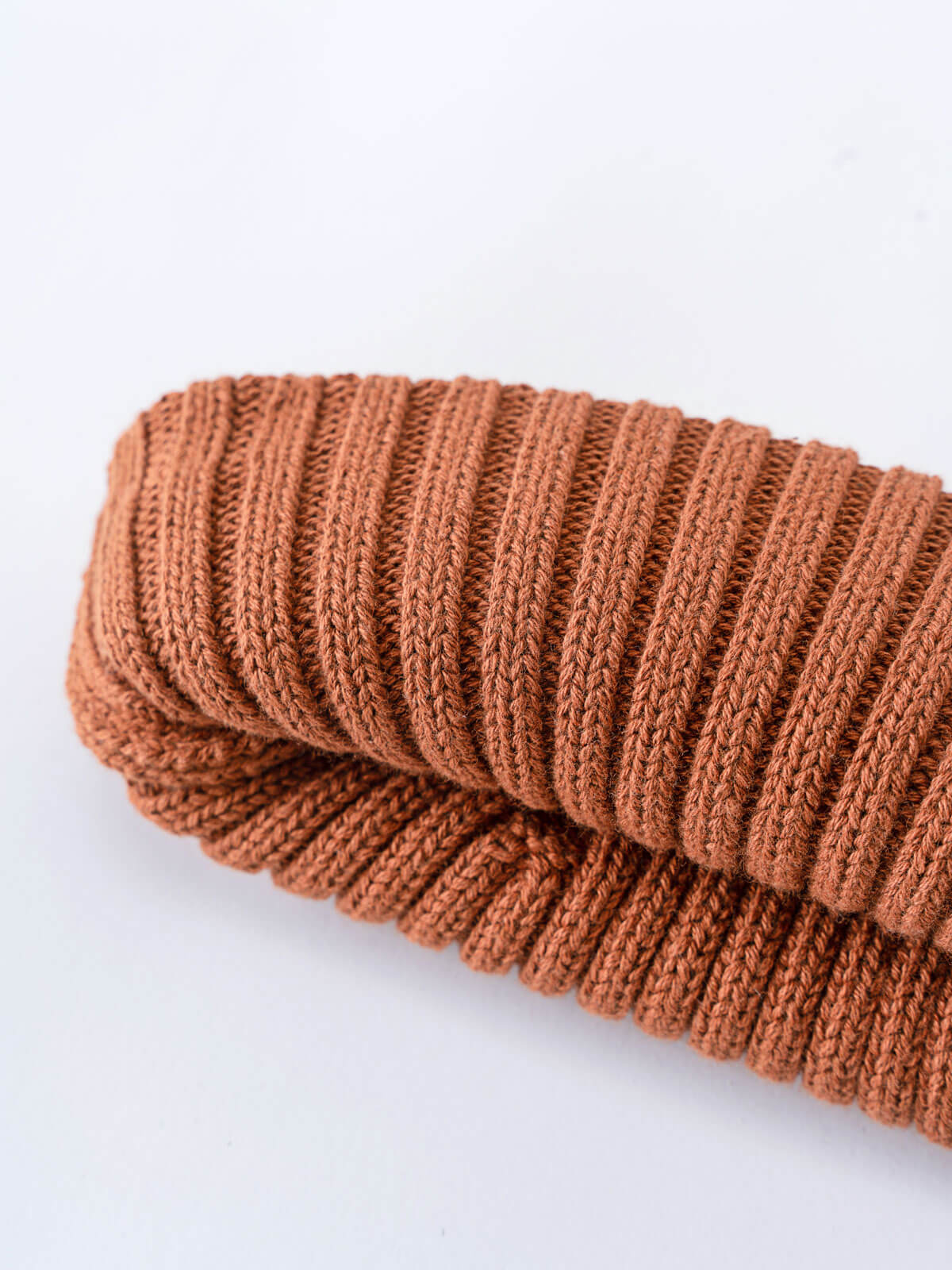 Brown knitted scarf on a white background Baby Ribbed Beanie - Russet Baby boy