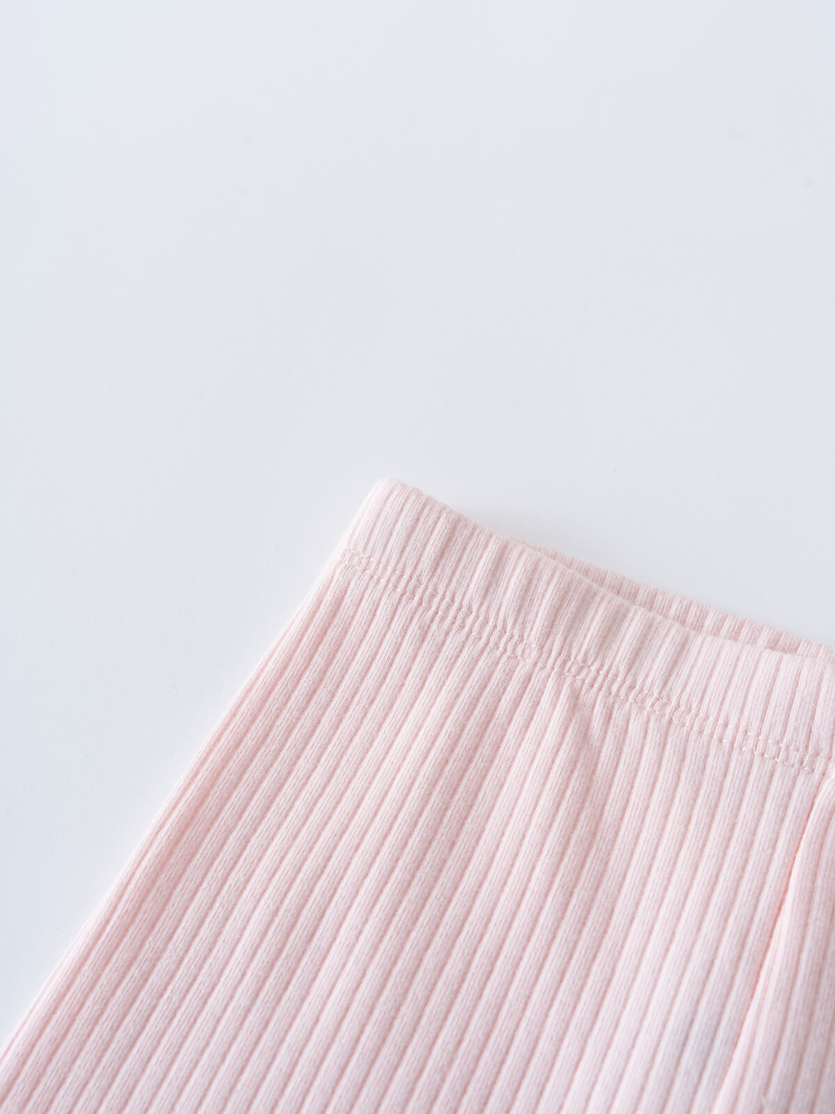 Close-up of ribbed pink fabric against a light background Baby Ribbed Leggings - Candy Floss Baby girl