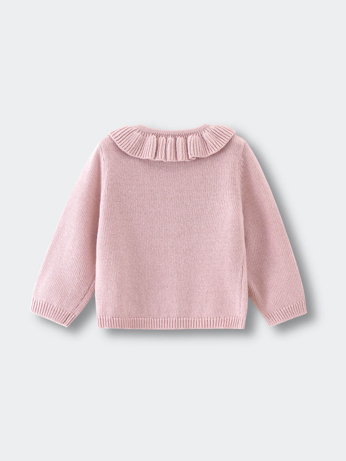 Pink knitted cardigan with a ruffled collar on a light gray background