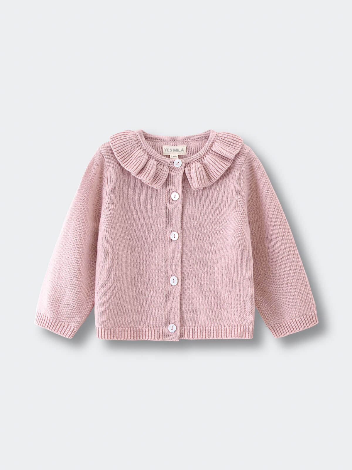 Pink knitted cardigan with ruffled collar on a light gray background