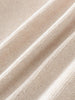 Close-up of beige fabric with a textured pattern