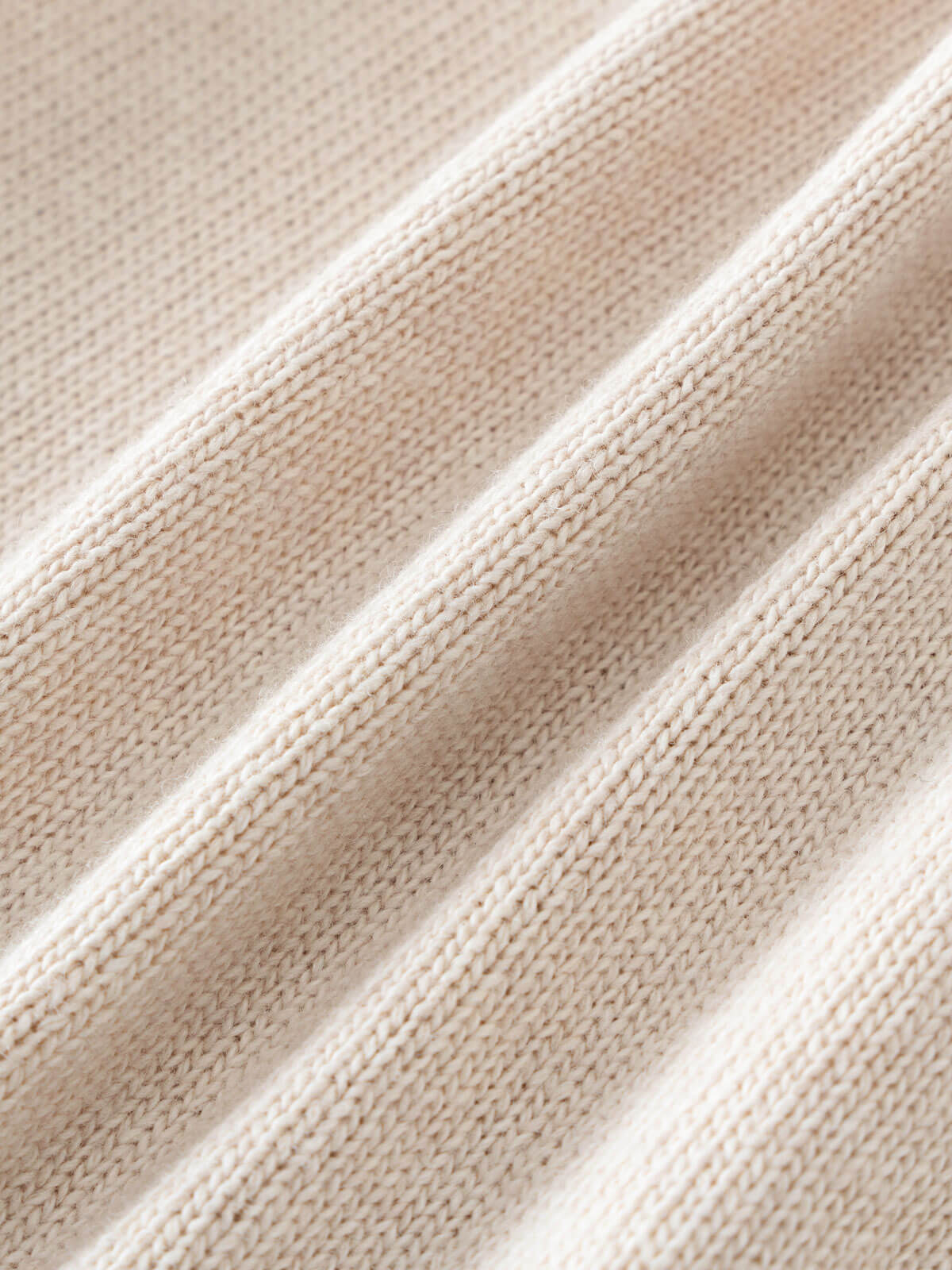 Close-up of beige fabric with a textured pattern