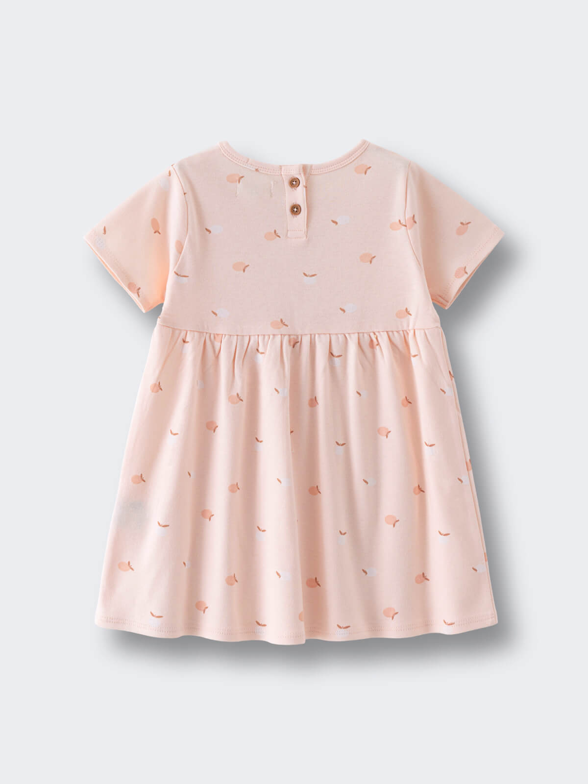 Back view of a pale pink dress with small apple print pattern Baby Short Sleeve Jersey Dress - Apples Baby girl