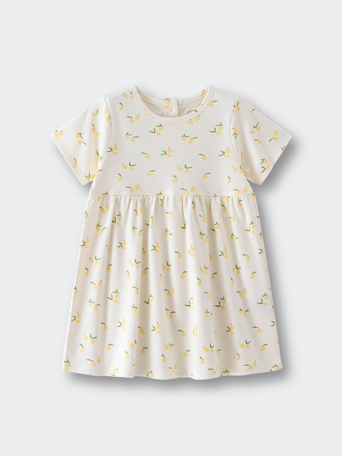 White dress with yellow lemon print pattern on a flat surface Baby Short Sleeve Jersey Dress - Lemons Baby girl