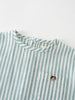 Close-up of green and white striped fabric with brown button detail Woven Stripe Tee Shirt - Mint Stripe Baby boy