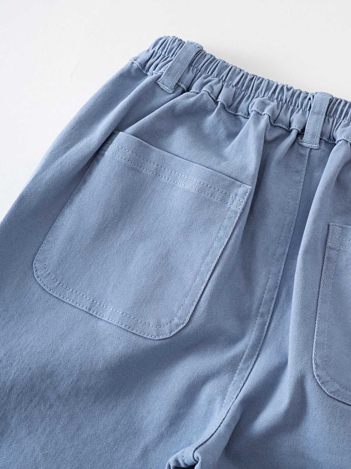 Close-up of light blue pants showing back pocket and elastic waistband Cargo Pants - Sky Blue Boys