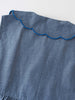 Close-up of blue chambray fabric with scalloped blue trim detail chambray Dress - Blue Chambray Girls
