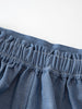 Close-up of gathered elastic waistband on blue chambray fabric shorts Chambray Shorts - Blue Chambray Girls
