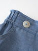 Close-up of blue chambray shorts with elastic waistband and button detail Chambray Shorts - Blue Chambray Girls