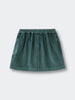 Green corduroy skirt on a light gray background