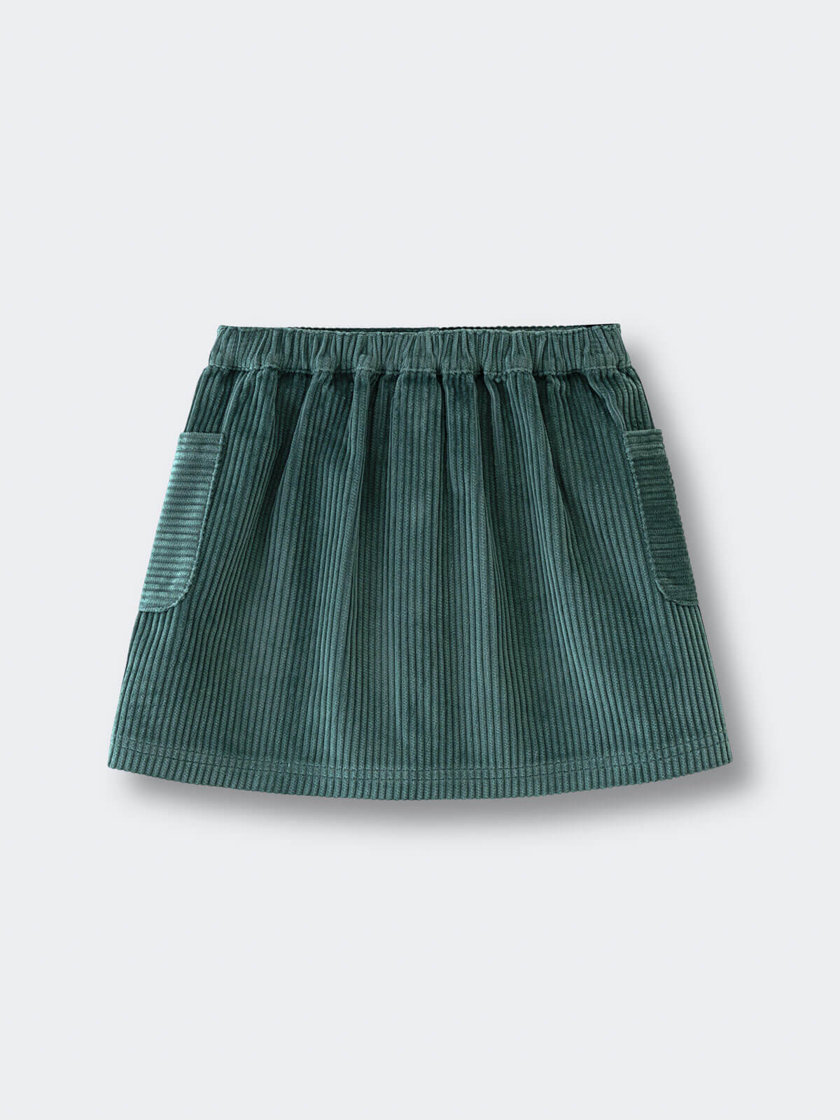 Green corduroy skirt on a light gray background