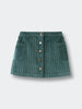 Green corduroy skirt with button details on a light gray background