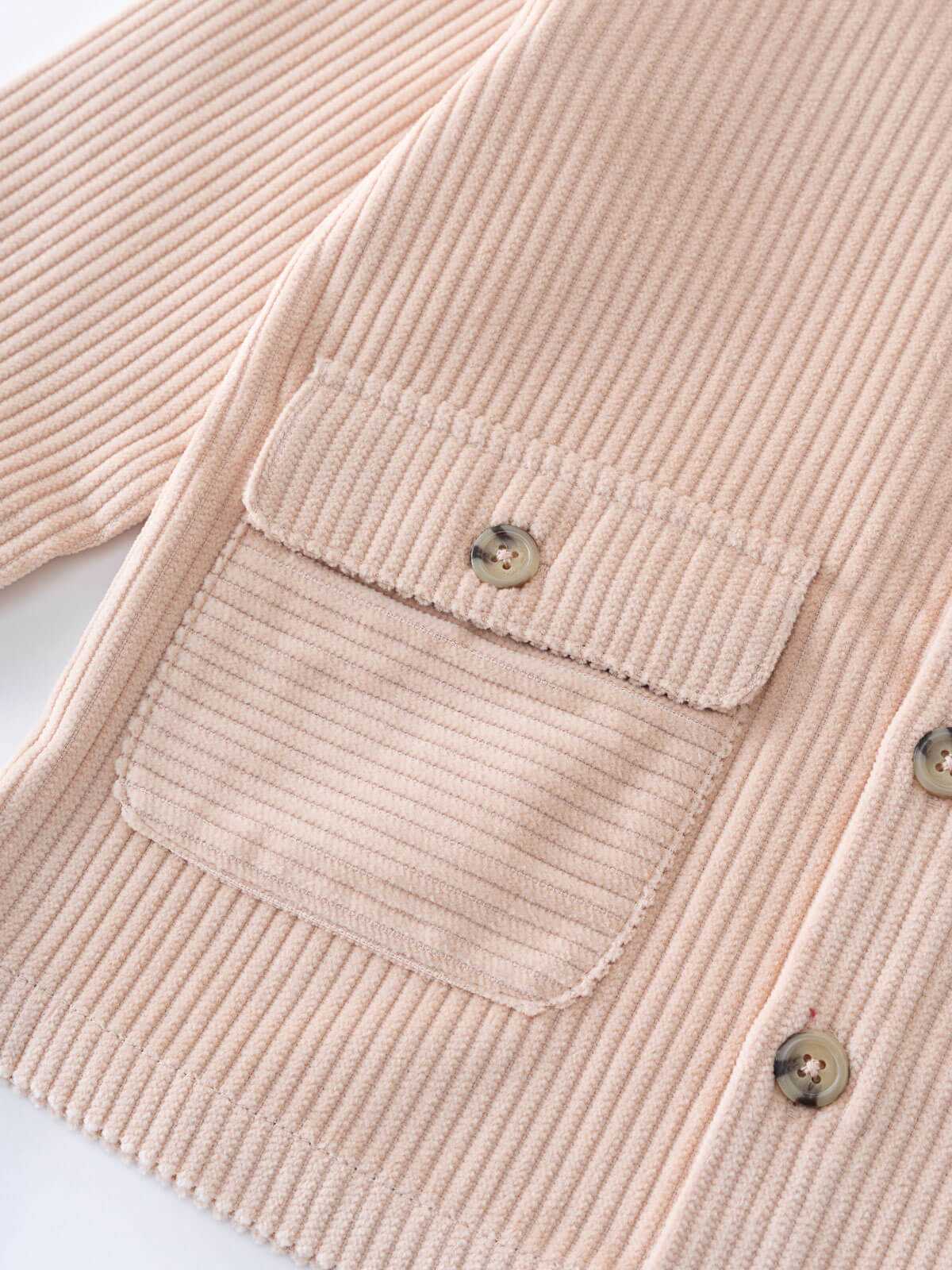 Close-up of a Beige corduroy jacket with a pocket and buttons on a white background Corduroy Jacket - Clay Girls and Boys