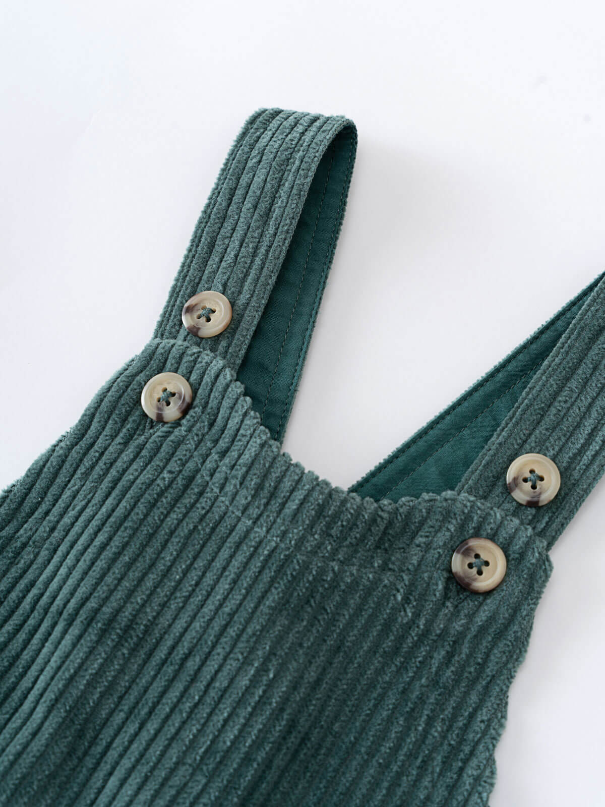Green corduroy overalls with button details on a white background Corduroy Overalls - Balsam Baby boy