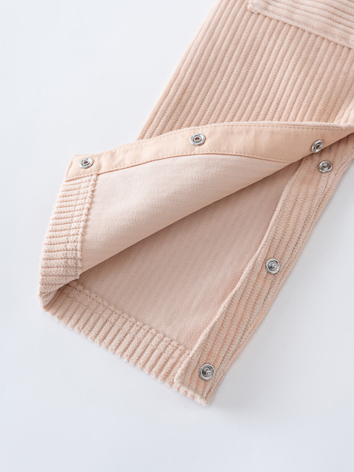 Close-up of a Beige corduroy overalls with button details on a white background Corduroy Overalls - Clay Baby boy