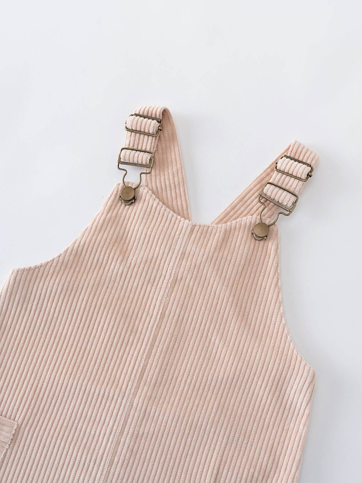 Beige corduroy pinafore dress with suspenders on a light gray background Corduroy Pinafore Dress - Clay Girls