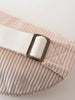 Pink corduroy waist bag with a white strap and brass buckle on a light background Crossbody Bag - Dove Girls
