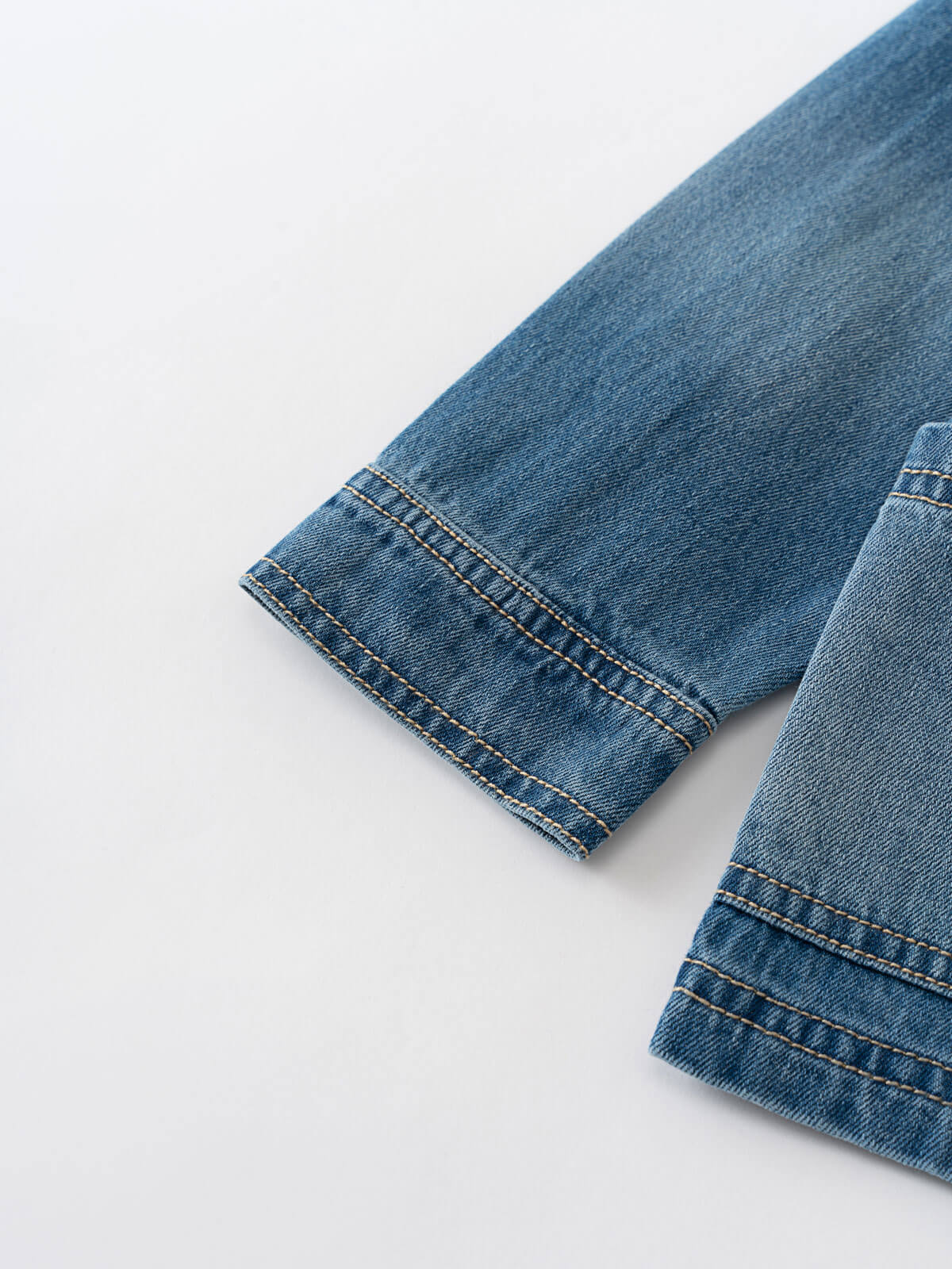 Close-up of blue denim jeans on a white background Denim Jacket - Blue Denim Girls and Boys