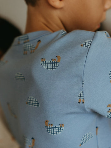 Close-up of light blue fabric with small tortoise pattern print Ezra Short Sleeve Tee Shirt - Tortoise Boys