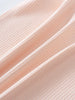 Close-up of ribbed fabric texture in soft peachy pink color Henley Short Sleeve Bodysuit - Shell Pink Baby girl