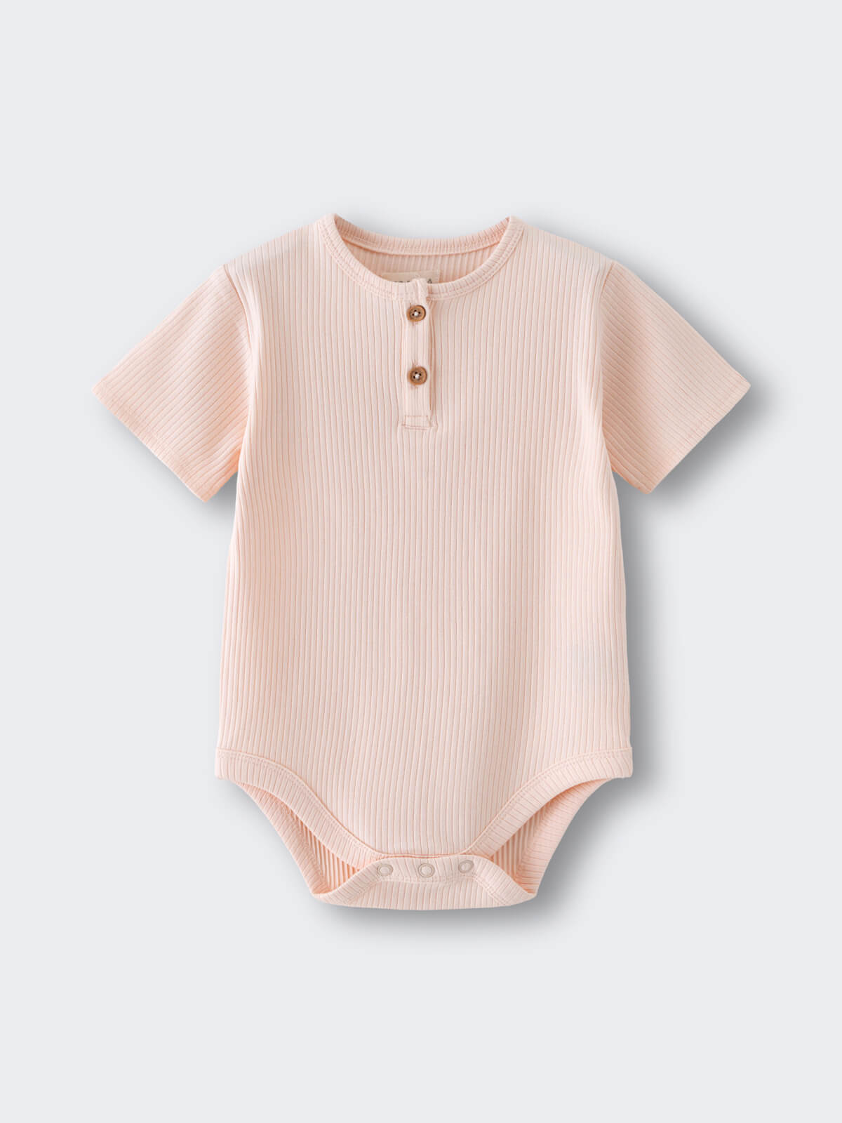 Light pink ribbed baby bodysuit with two brown buttons at neckline Henley Short Sleeve Bodysuit- Shell Pink Baby girl
