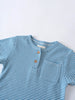 Close-up of a blue and white striped shirt with two wooden buttons Henley Tee - Blue Stripe Boys