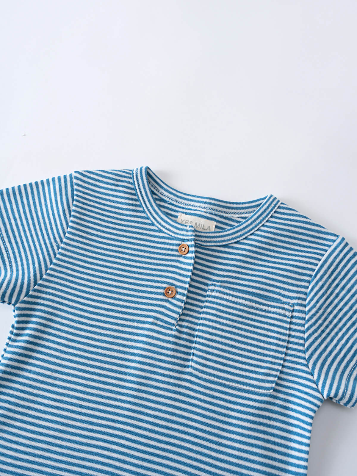 Close-up of a blue and white striped shirt with two wooden buttons Henley Tee - Blue Stripe Boys