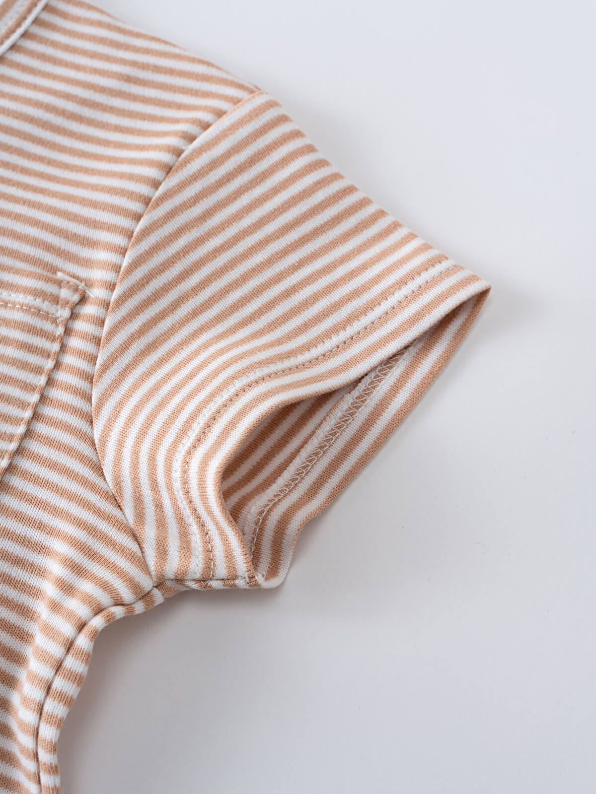 Close-up of a striped ribbed shirt sleeve in tan and white Henley Tee - Sand Stripe Boys