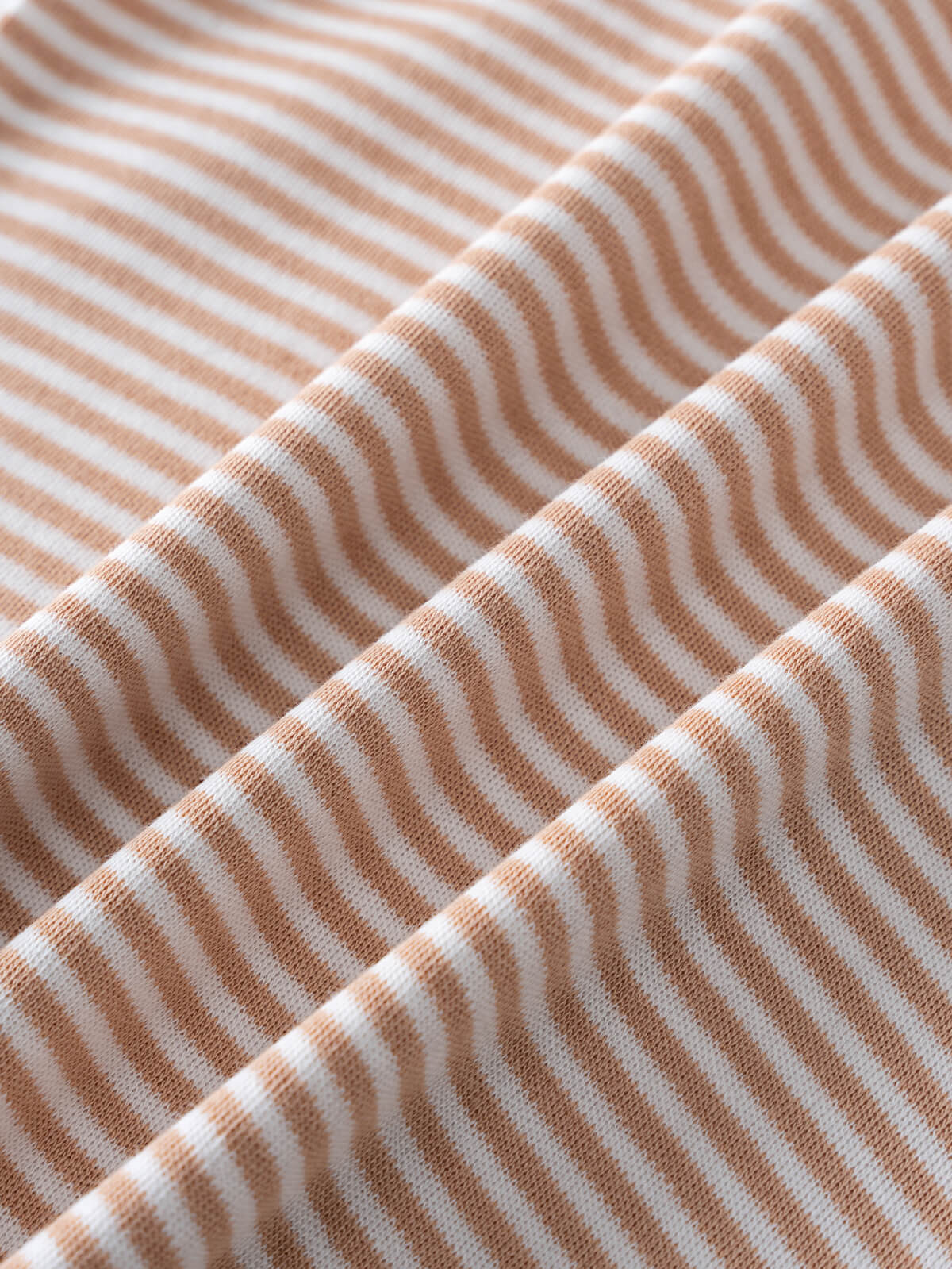 Close-up of brown and white striped knit fabric with visible texture Henley Tee - Sand Stripe Boys