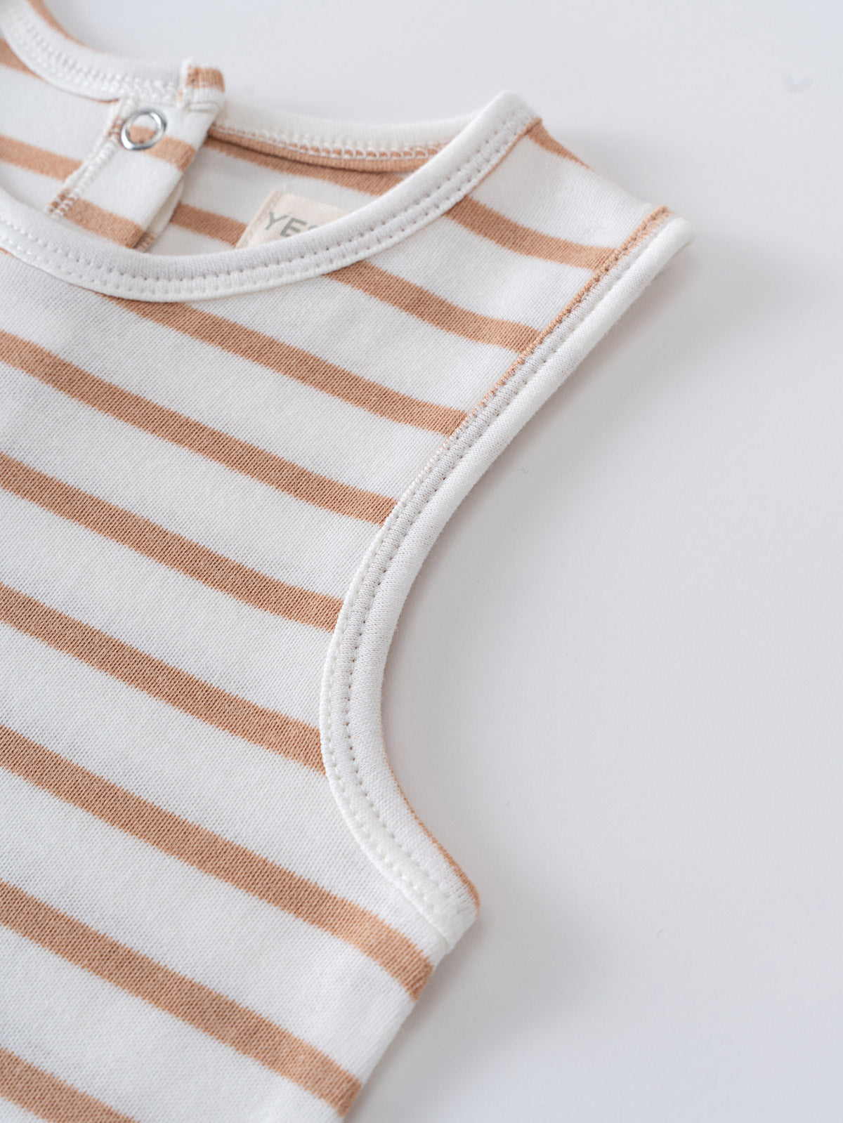 Close-up of a striped baby romper with snap closure at shoulder jersey Romper - Sand Stripe Baby boy