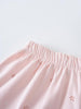 Close-up of pink fabric skirt with elastic waistband and floral embroidery details Jersey Skirt - Spring Love Girls