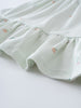 Close-up of light green fabric with small peach and fruit print pattern Jersey Skirt - Summer Fruits Girls