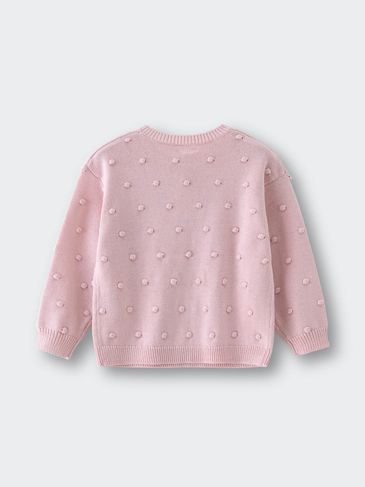 Pink knitted sweater with raised polka dot texture laid flat Knit Jumper - Candy Floss Girls