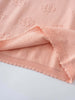 Close-up of pink knitted fabric with eyelet detail and scalloped trim Knit Tee - Toasted Peach Girls