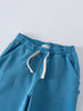 Blue sweatpants with white drawstring and elastic waistband on gray surface Light Sweatpants - Marine Boys