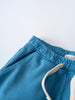 Close-up of blue sweatpants with elastic waistband and white trim detail Light Sweatpants - Marine Boys